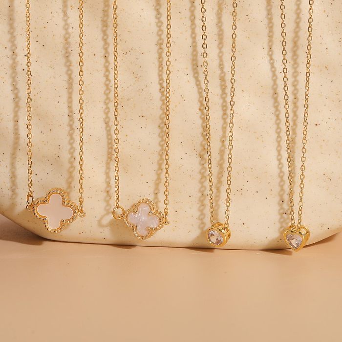 Collier pendentif en plaqué or 14 carats avec trèfle à quatre feuilles de style classique de vacances en forme de cœur rond en acier inoxydable avec incrustation de résine et zircone