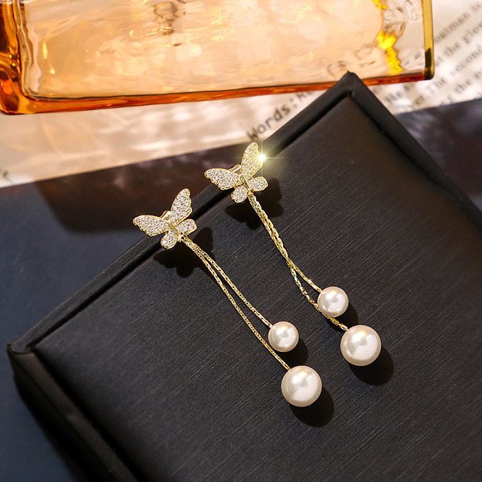 1 par de pendientes colgantes de perlas con diamantes de imitación de acero inoxidable con incrustaciones de mariposas brillantes estilo IG