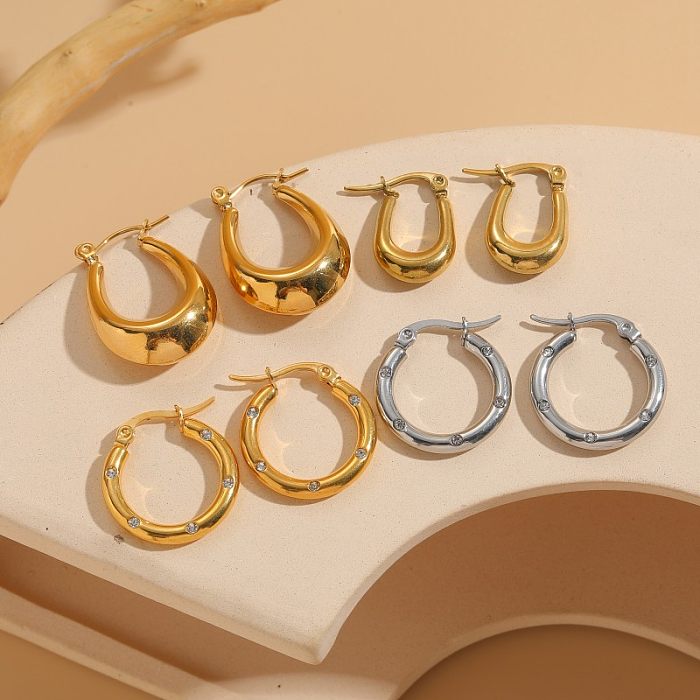 1 Paar elegante C-förmige, U-förmige, asymmetrische, plattierte Inlay-Ohrringe aus Edelstahl mit Zirkon und 14-Karat-Vergoldung