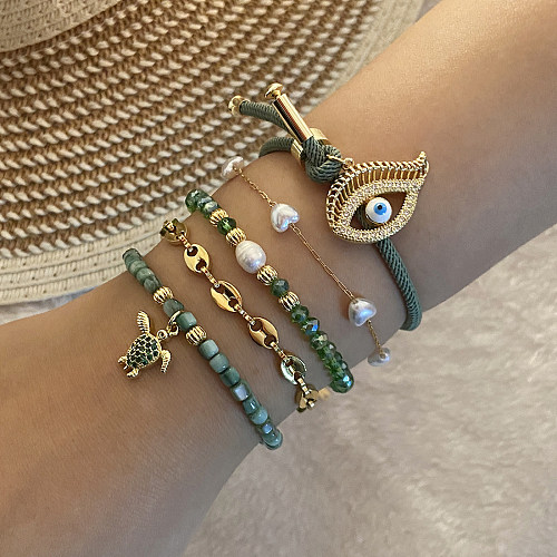 Großhandel Lady Simple Style Eye Edelstahl Shell Perlen Armbänder