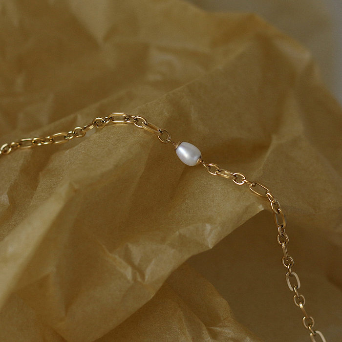 Bracelet en acier au titane avec chaîne d'épissure ovale et perle d'eau douce