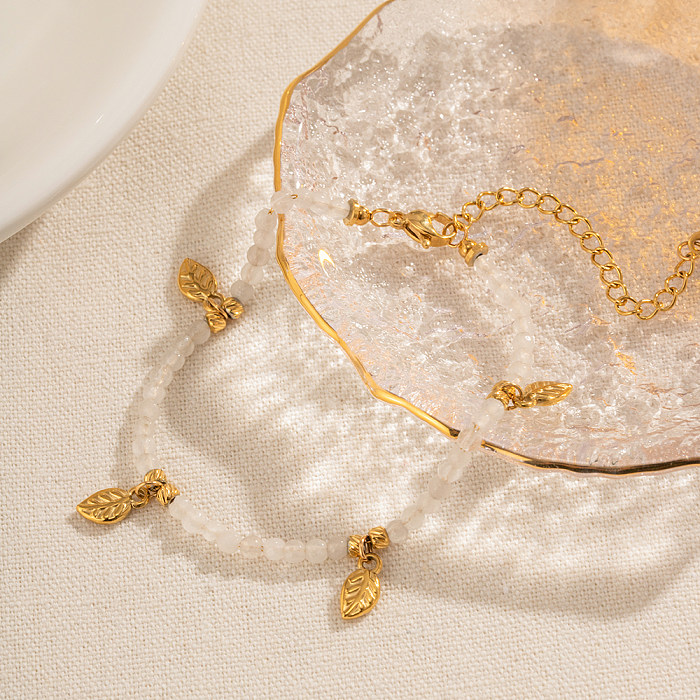 Pulseiras banhadas a ouro 18K elegantes com folhas retrô de aço inoxidável com borla de pedra