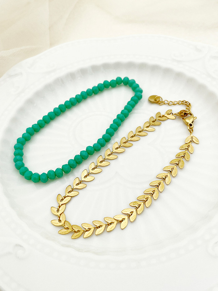 Lady Leaves-Armbänder aus Edelstahl mit Perlenbeschichtung und 14-Karat-Vergoldung