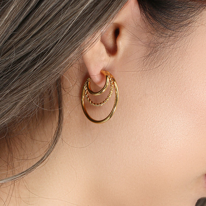 Modische, mehrschichtige, hohle Twist-C-Typ-Ohrringe aus Edelstahl mit 18-Karat-Vergoldung