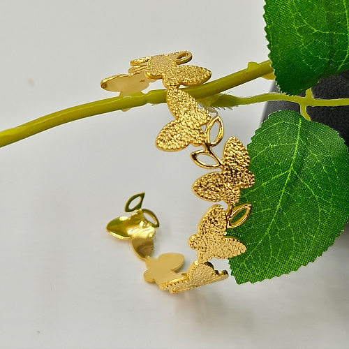 Manschettenarmbänder im klassischen Schmetterlingsstil aus Titanstahl mit 18-Karat-Vergoldung in großen Mengen