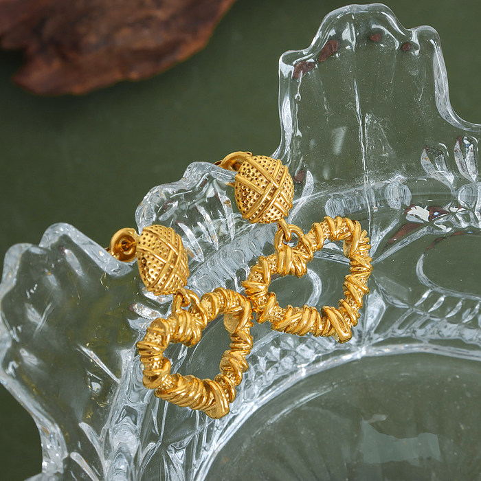 1 par de pendientes colgantes chapados en oro de 18 quilates de acero inoxidable con forma de corazón artístico elegante