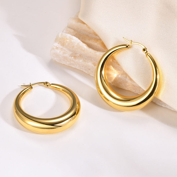 1 par de brincos de argola banhados a ouro de aço inoxidável com revestimento de cor sólida estilo simples