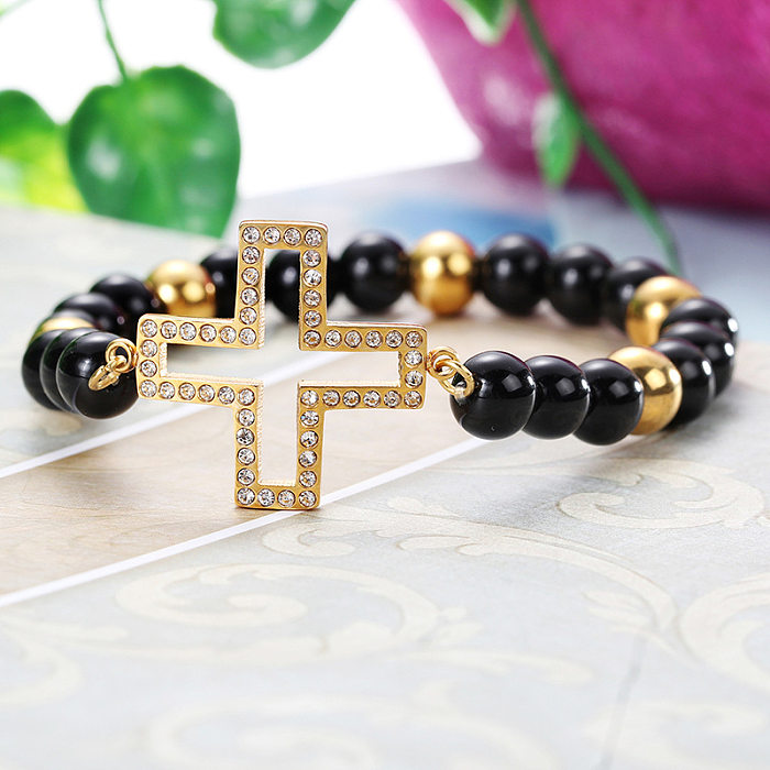 Europäisches und schönes Edelstahl-Perlenarmband, hohles Kreuz, Retro-elastisches Armband