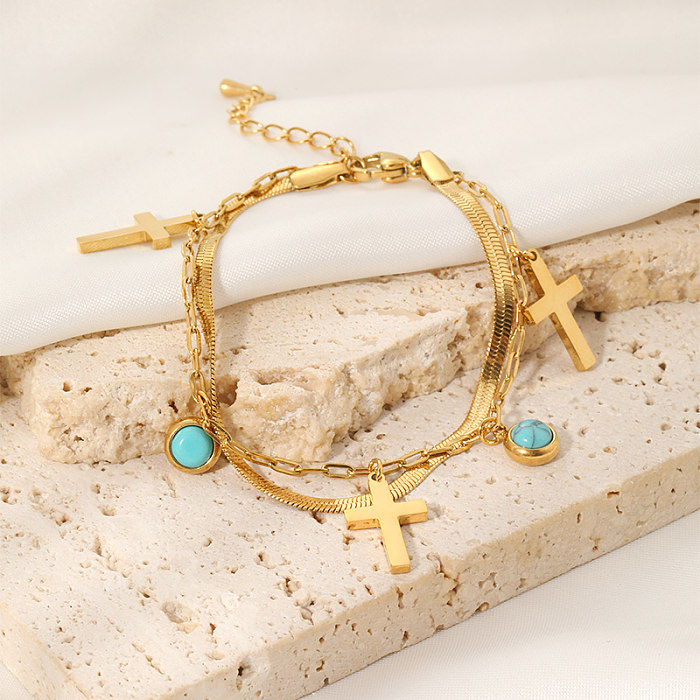 Coole, glänzende, kreuzförmige, runde, geschichtete Edelstahl-Inlay-Armbänder mit türkisfarbener 18-Karat-Vergoldung