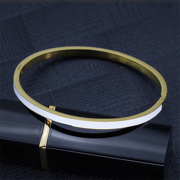 Bracelet plaqué or époxy en acier titane avec bloc de couleur de style simple