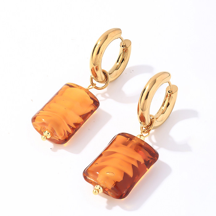 1 par de pendientes colgantes chapados en oro de acero inoxidable con revestimiento ovalado redondo de estilo simple