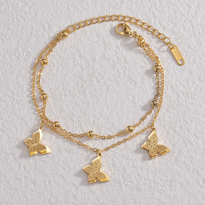 Elegante estilo simples borboleta comutar pulseiras banhadas a ouro 14K em aço inoxidável