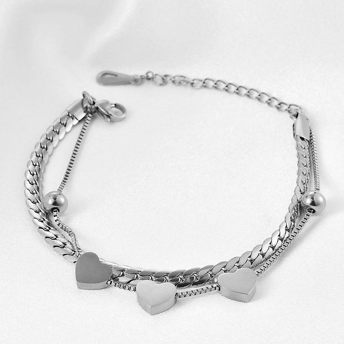 Pulsera de doble capa de acero titanio Chian con costura en forma de corazón de estilo simple