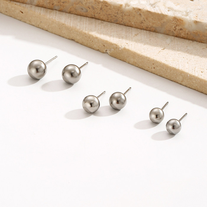 3 أزواج من أقراط الأذن الدائرية المصنوعة من الفولاذ المقاوم للصدأ والتي تتميز بتصميم بسيط غير رسمي