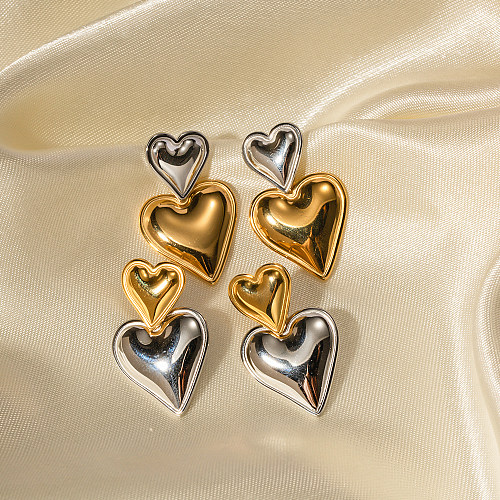 زوج واحد من الأقراط المتدلية المطلية بالذهب عيار 1 قيراط المصنوعة من الفولاذ المقاوم للصدأ على شكل قلب على شكل IG