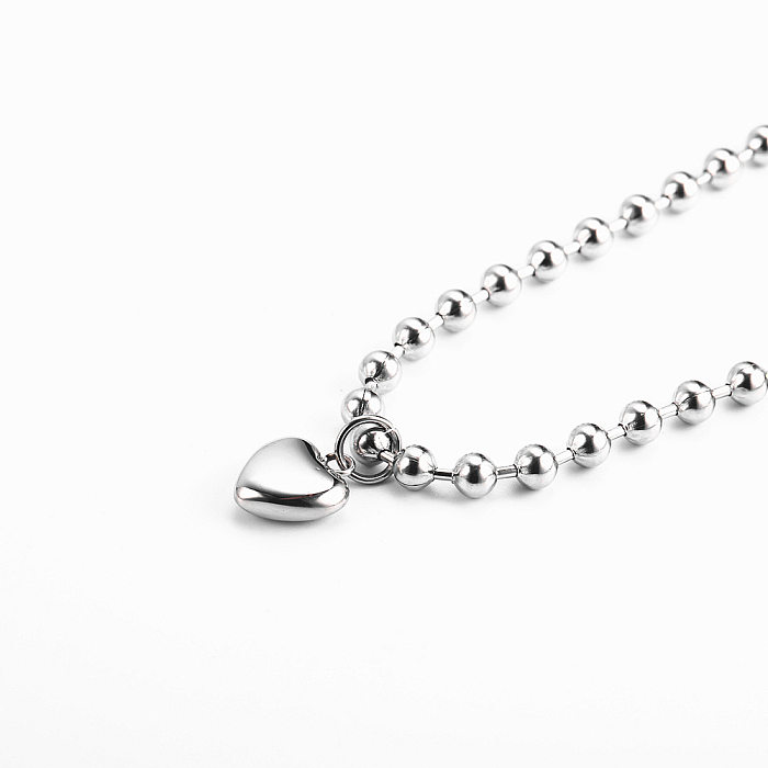 Pulseiras de aço de titânio em forma de coração da moda com revestimento de pulseiras de aço inoxidável