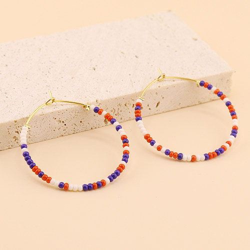 1 Paar handgefertigte Kreis-Perlen-Ohrringe aus Edelstahl und Glas