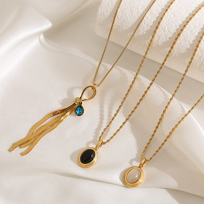 Elegante, luxuriöse Halskette mit ovaler Quaste und Intarsien aus Edelstahl mit vergoldetem Edelstein
