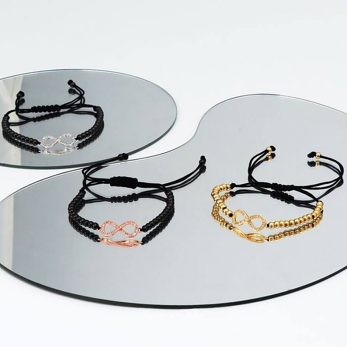 Elegante, luxuriöse Infinity-Armbänder aus Edelstahl mit Zopfeinlage und Strasssteinen