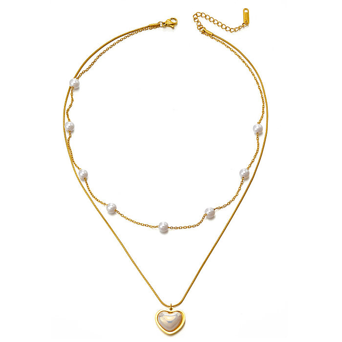 Collier de perles artificielles incrusté d'acier inoxydable en forme de cœur à la mode