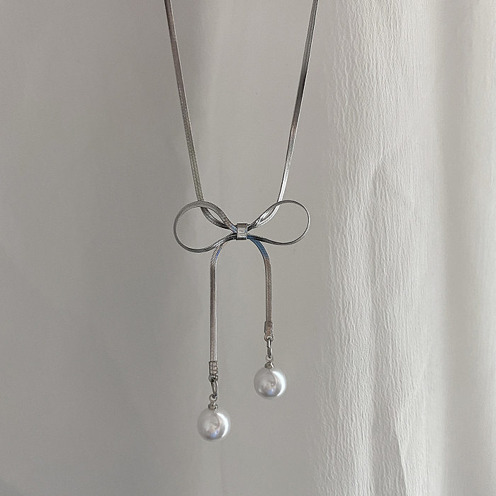 Elegante Halskette mit süßen Schleifenknoten und künstlichen Perlen aus Edelstahl mit Inlay