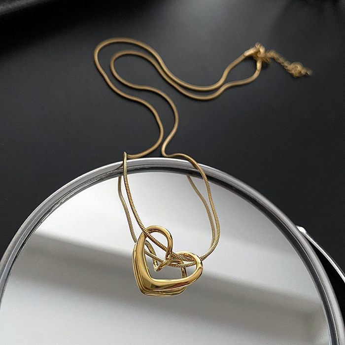 Collier à pendentif ajouré en acier inoxydable en forme de cœur à la mode, 1 pièce