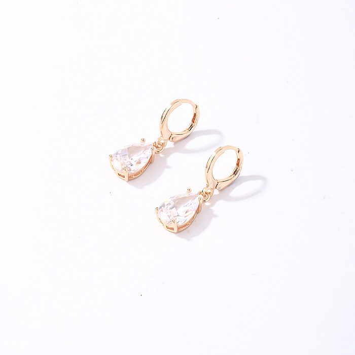 1 paire de boucles d'oreilles rondes en forme de trèfle à quatre feuilles de style coréen avec incrustation de placage en acier inoxydable et zircon plaqué or