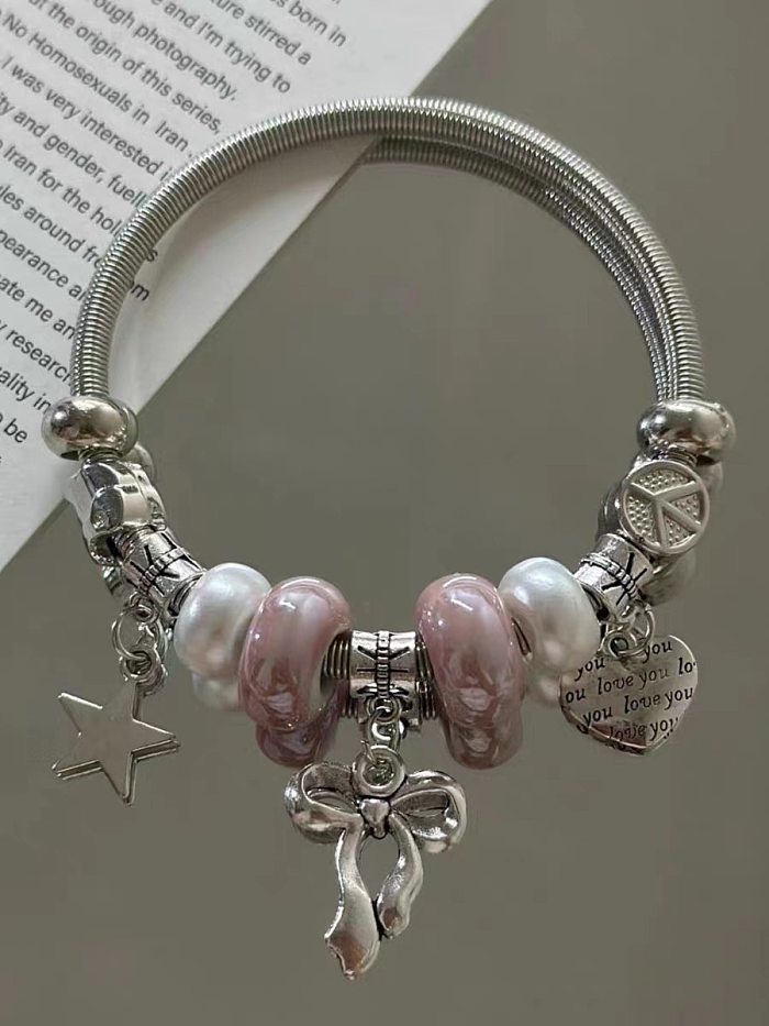 Bracelet plaqué en acier inoxydable avec nœud papillon doux