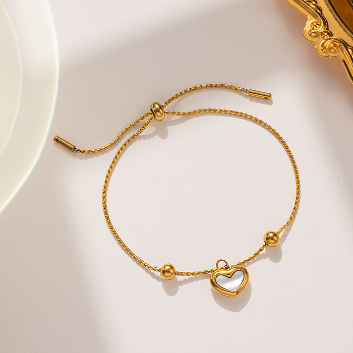 Bracelets plaqués or 18K de Shell d'incrustation de placage en acier de forme de coeur de style simple élégant