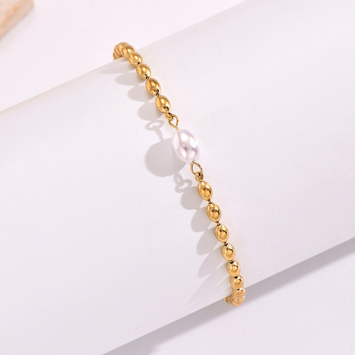 Pulseras redondas chapadas en oro de 14 quilates con revestimiento de perlas de acero inoxidable de estilo simple