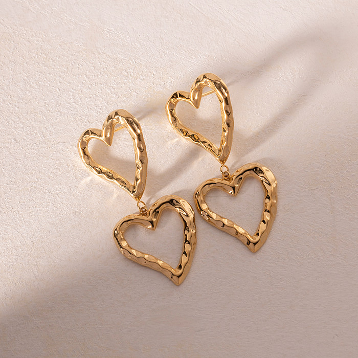 1 par estilo IG estilo simples formato de coração chapeado oco aço inoxidável 18K brincos banhados a ouro