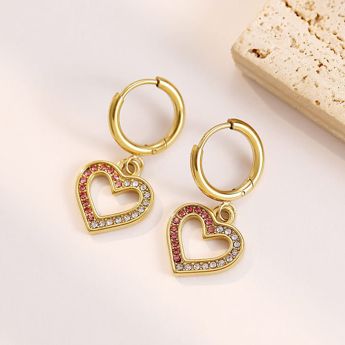 1 paire de boucles d'oreilles pendantes en forme de cœur en acier inoxydable plaqué or blanc