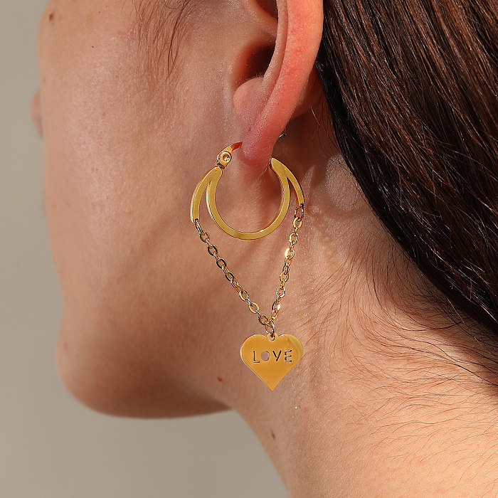 1 paire de boucles d'oreilles pendantes en forme de cœur et papillon plaqué en acier inoxydable