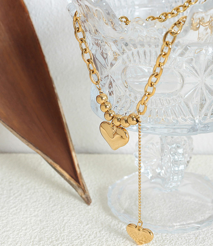 Collier long avec pendentif plaqué or 18 carats, style simple, en forme de cœur, plaqué en acier inoxydable