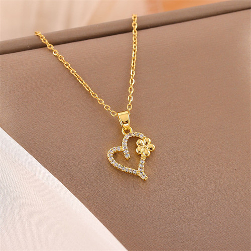 Glänzende Halskette in Herzform aus Edelstahl mit Inlay aus Zirkon und 18-karätigem Gold