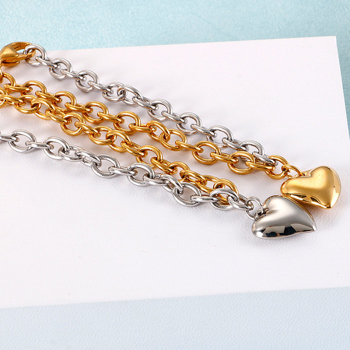 Von AliExpress Europäische und amerikanische Mode Titanstahl Damen galvanisiert 18 Karat Goldfarbe Liebesanhänger Damenarmband