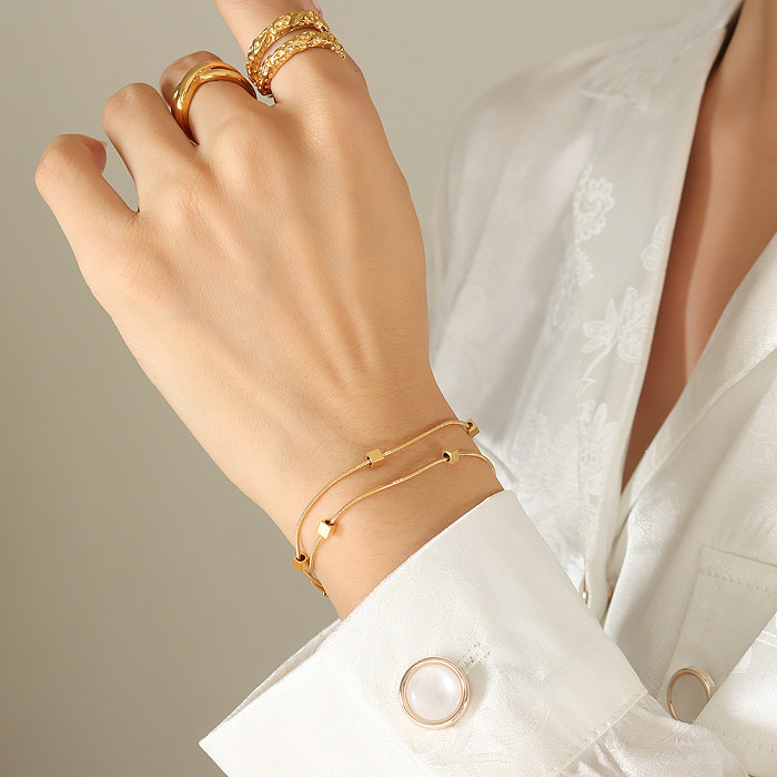 Elegante, quadratische Armbänder im Feen-Stil mit Titanstahlbeschichtung und 18-Karat-Vergoldung