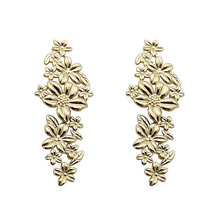 1 par de pendientes chapados en oro de acero inoxidable con diseño de flor de señora