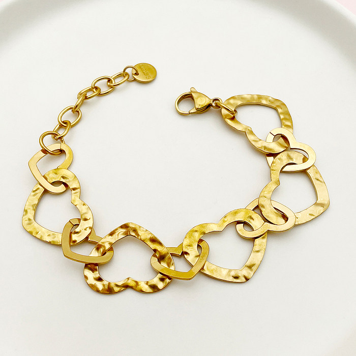 Pulseiras banhadas a ouro de aço inoxidável em formato de coração oval estilo romano retrô a granel