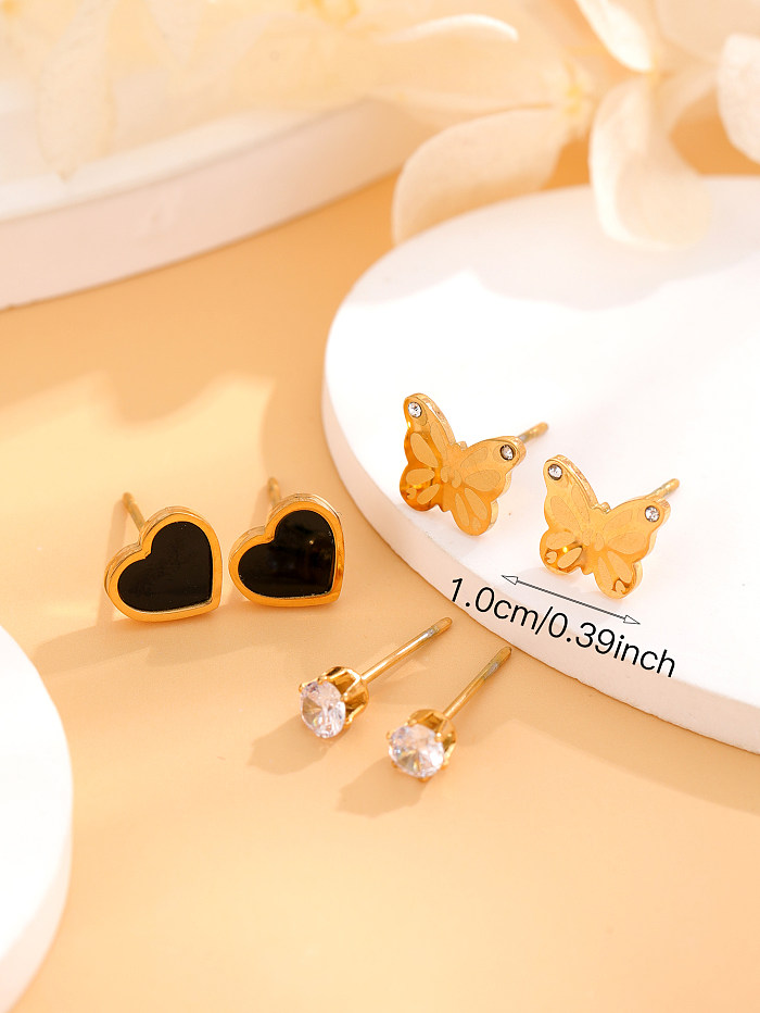 1 ensemble de clous d'oreille plaqués or 18 carats avec incrustation de placage papillon en forme de cœur de style simple et romantique élégant en acier inoxydable et zircon