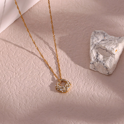 Collier élégant avec pendentif en perles de strass et incrustation irrégulière en acier inoxydable