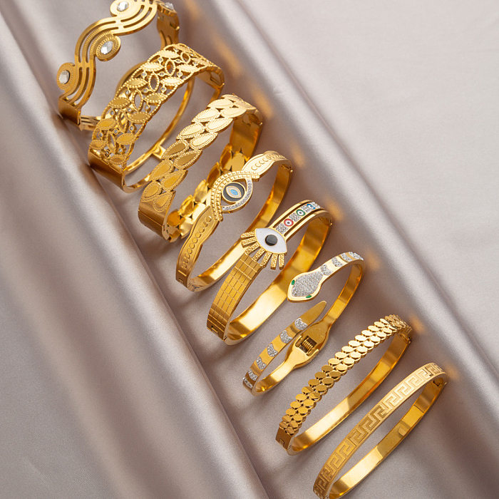 Brazalete chapado en oro de 18 quilates con incrustaciones de acero de titanio y serpiente redonda de estilo simple y clásico