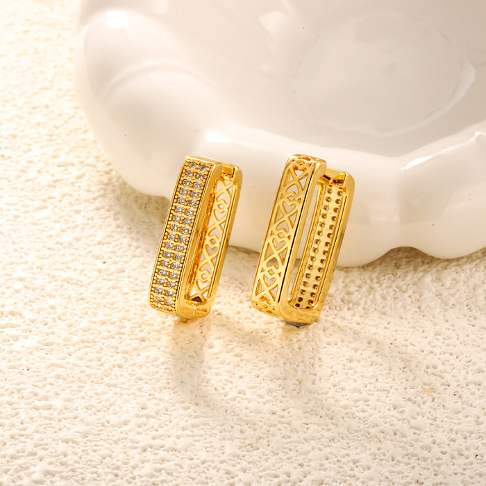 Brass rectangular geometric pattern with hollow texture inlaid with zircon ear buckle