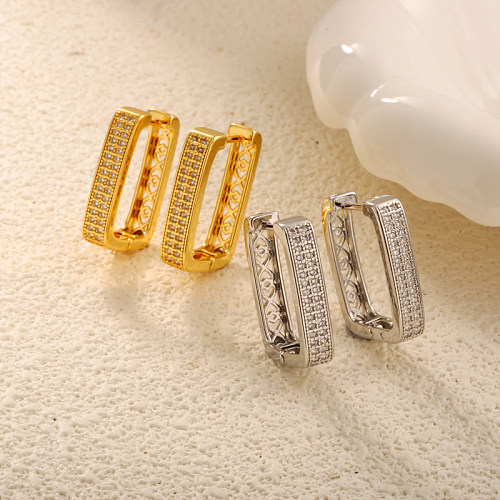 Brass rectangular geometric pattern with hollow texture inlaid with zircon ear buckle