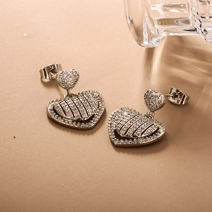 Brass heart-shaped circular geometric pattern inlaid with zircon earrings