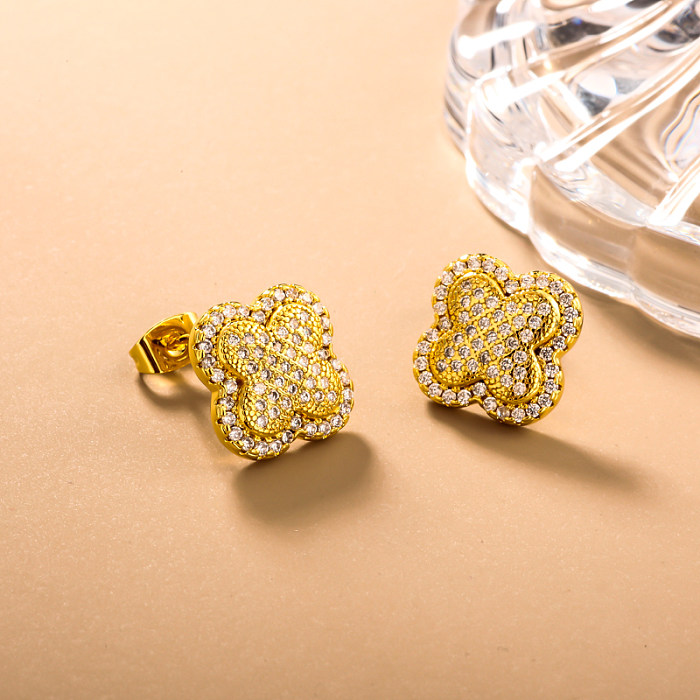 Brass clover inlaid zircon ear buckle