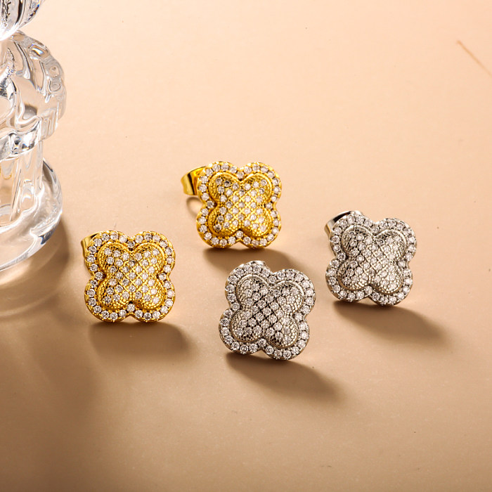 Brass clover inlaid zircon ear buckle