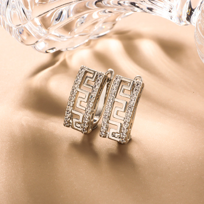 Brass rectangular inlaid zircon hollow pattern ear buckle