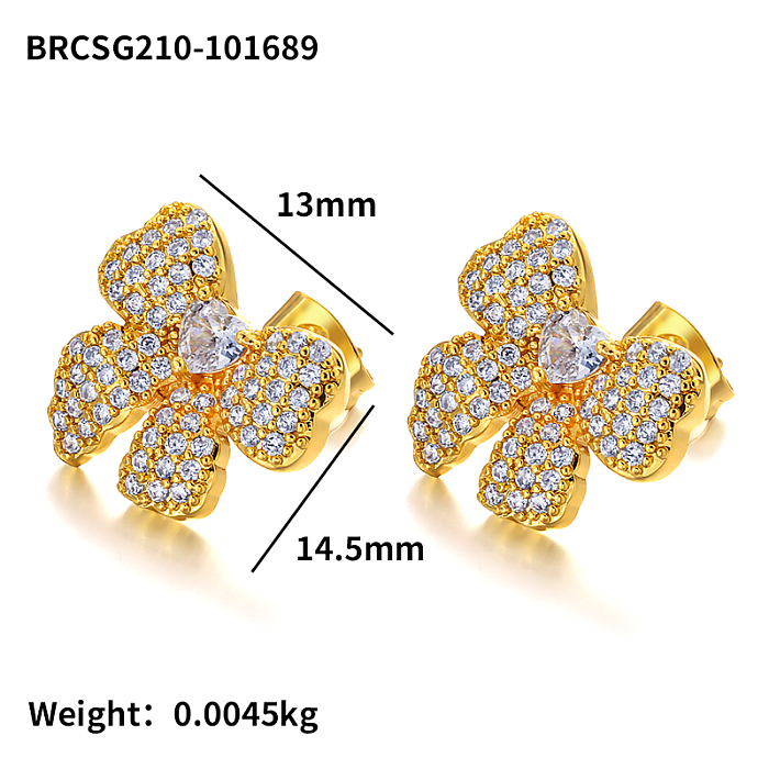 Lazo de latón con pendientes de circonitas incrustadas.