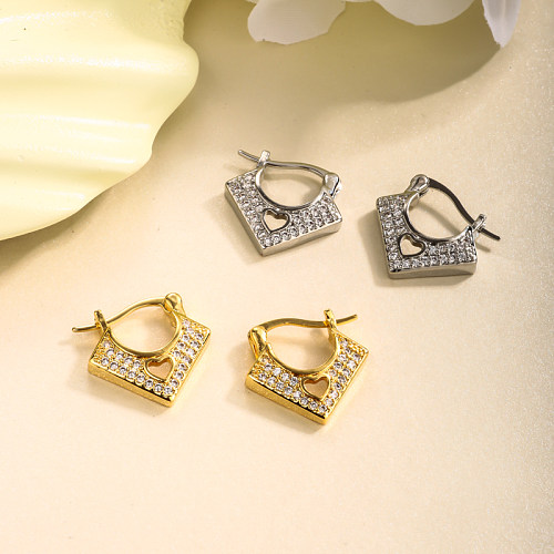 Brass V-shaped hollow heart-shaped hollow inlaid zircon ear buckle